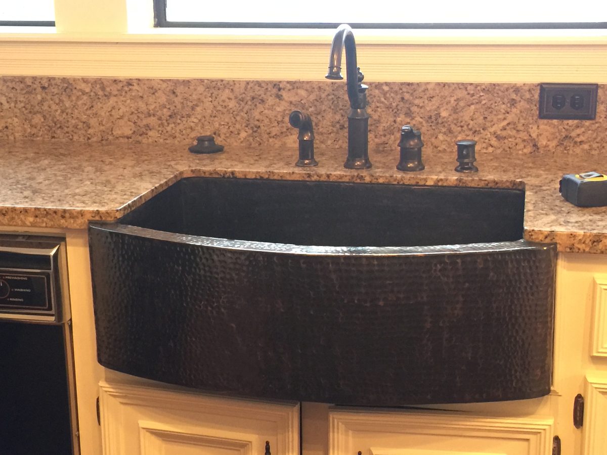 Custom kitchen by Haven Renovations — apron front, stone surround