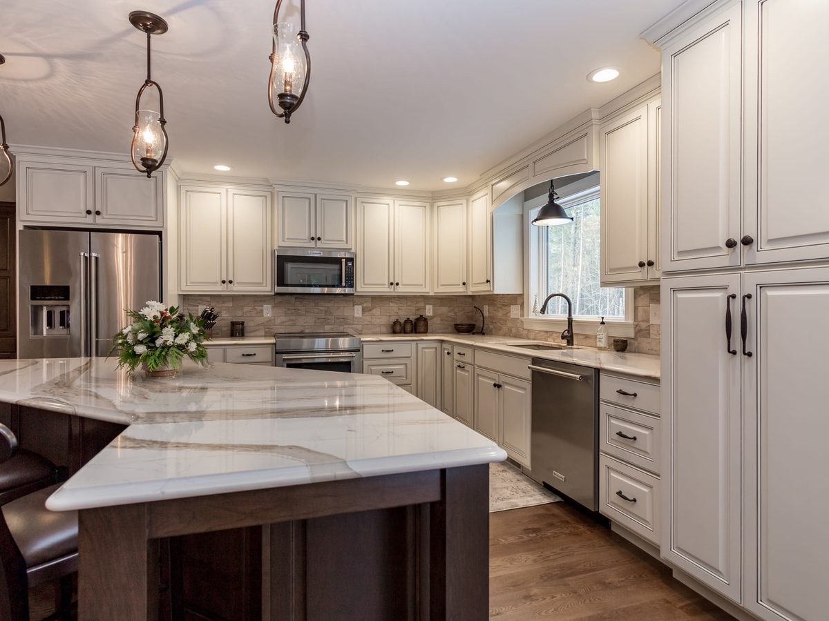 Custom kitchen by Haven Renovations — stone top, counter seating