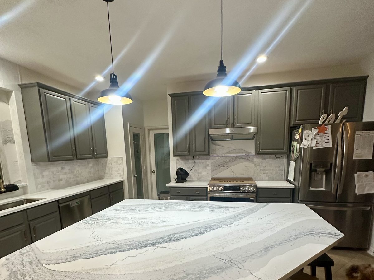 Custom kitchen by Haven Renovations — gray cabinetry, counter seating
