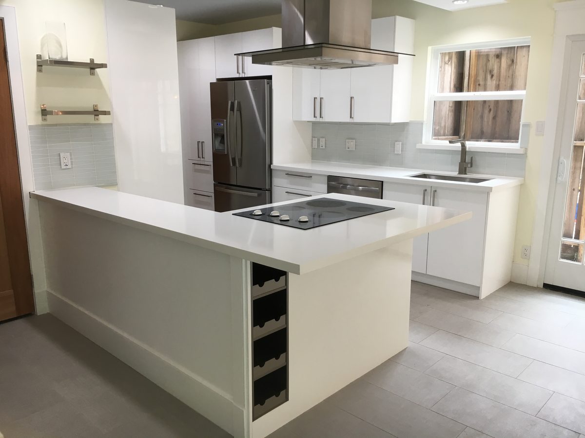 Custom kitchen by Haven Renovations — integrated wine storage