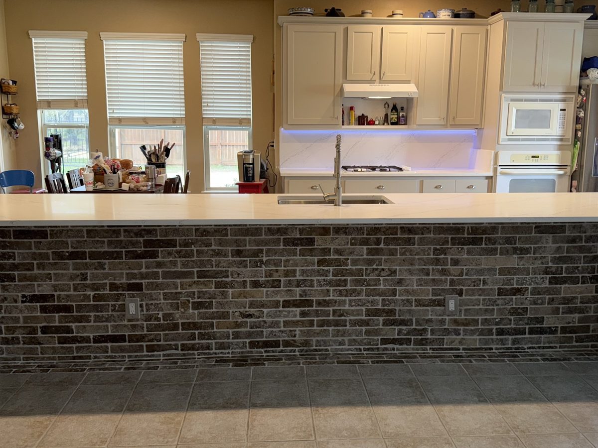 Custom kitchen by Haven Renovations — bar counter, painted cabinetry