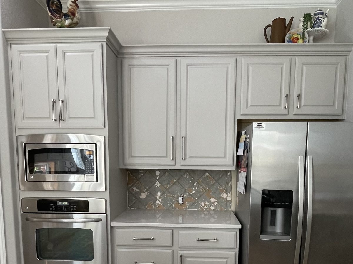 Custom kitchen by Haven Renovations — gray cabinetry, wall ovens