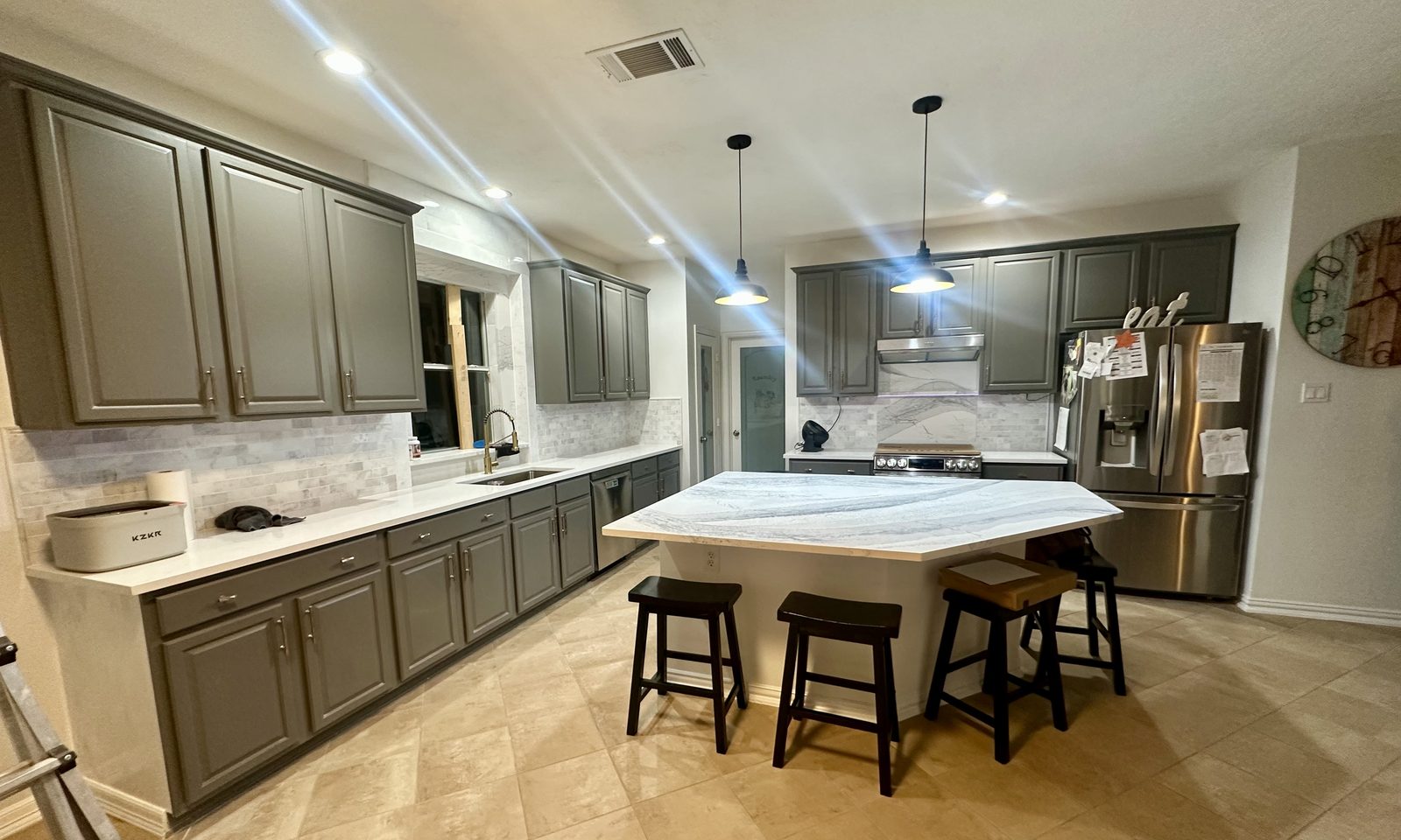 Custom kitchen by Haven Renovations — long island with bar seating