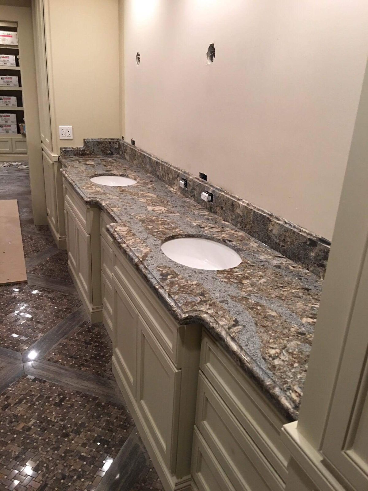 Frameless glass shower with marble tile surround