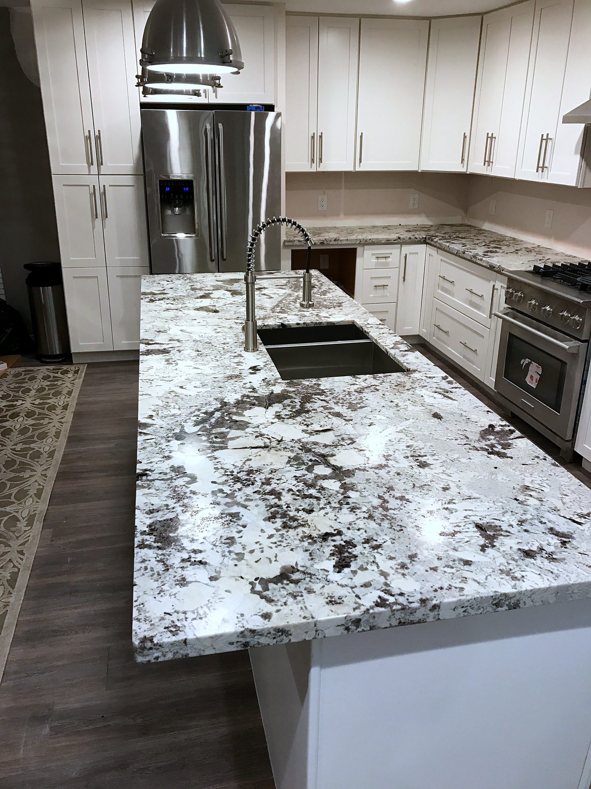 Custom kitchen by Haven Renovations — undermount sink, white shaker