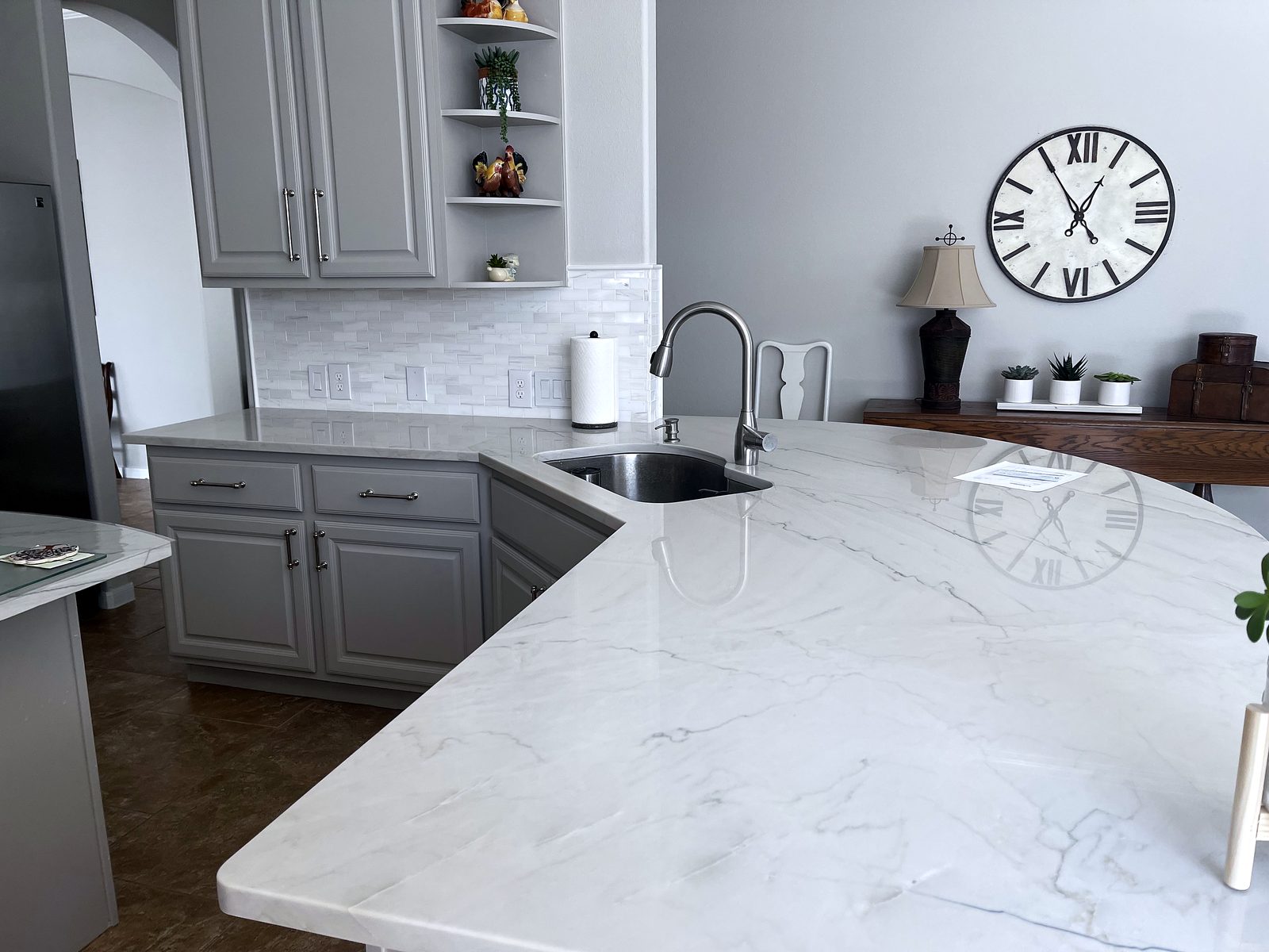 Custom kitchen by Haven Renovations — open shelving, grey cabinetry