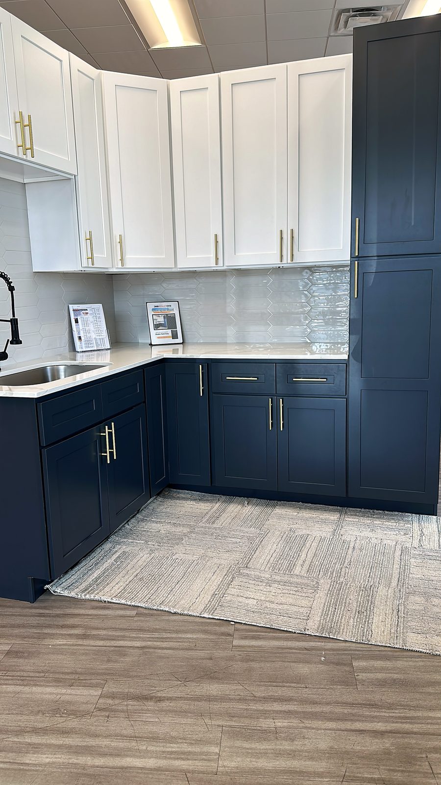 Custom kitchen by Haven Renovations — hex tile, quartz tops