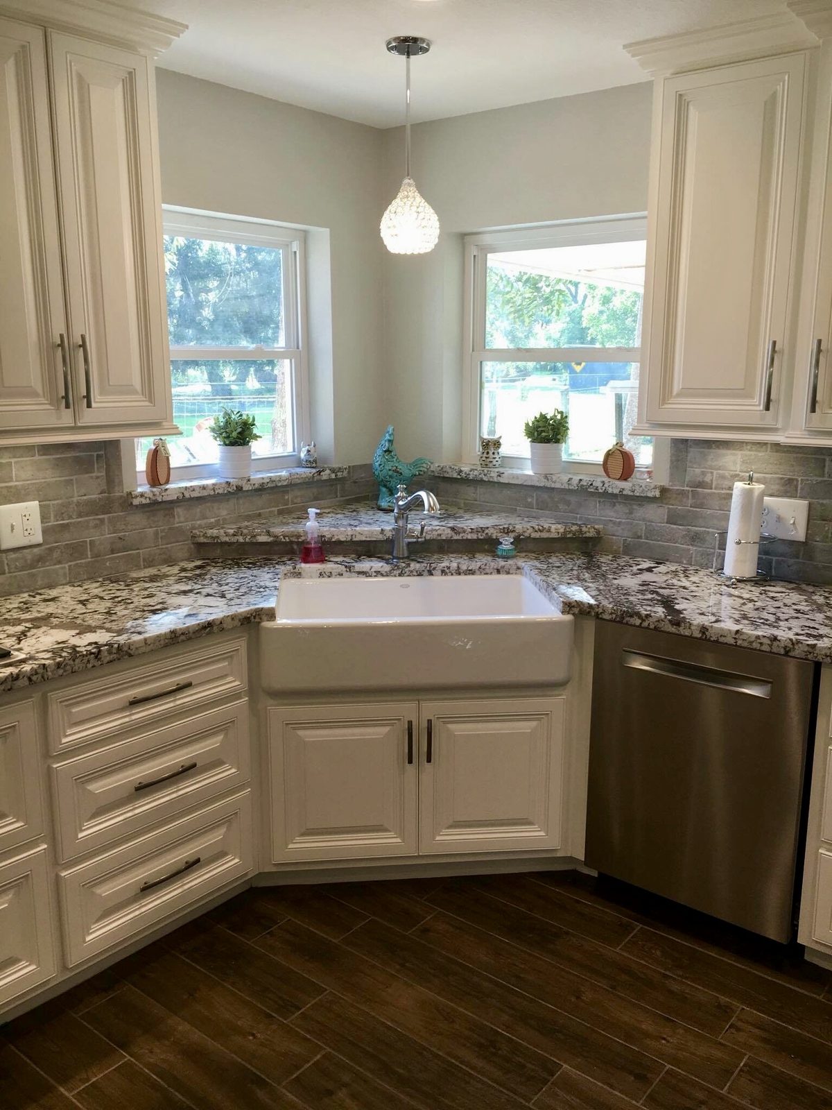 Custom kitchen by Haven Renovations — farmhouse apron sink with stone counters